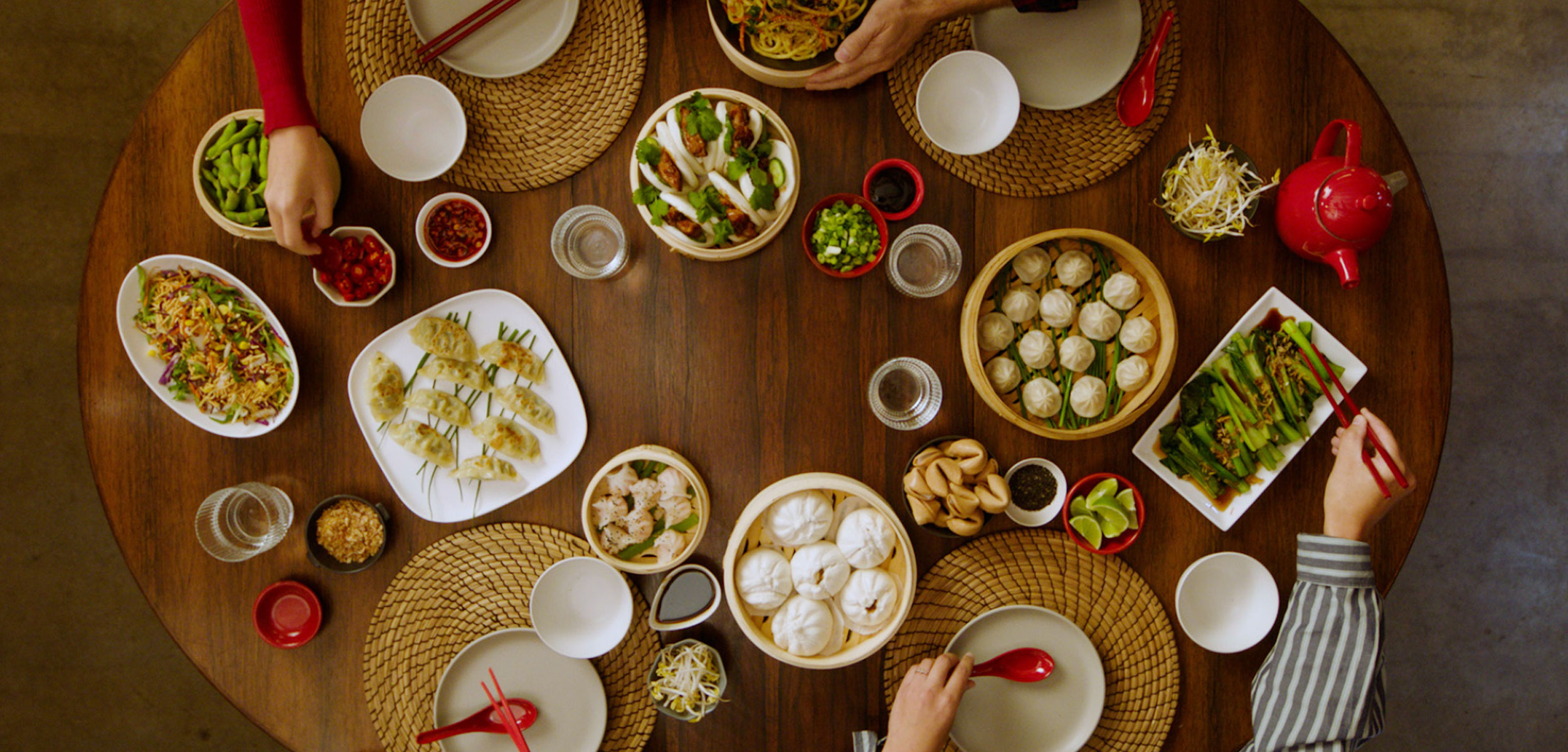 A family at the dinner table having a chinese feast